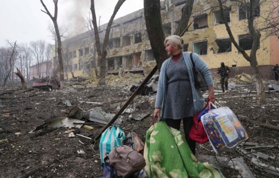 Woman outside Mariupol Maternity Hospital after Russia bombed it on 9 March Photo Evgeniy Maloletka, AP