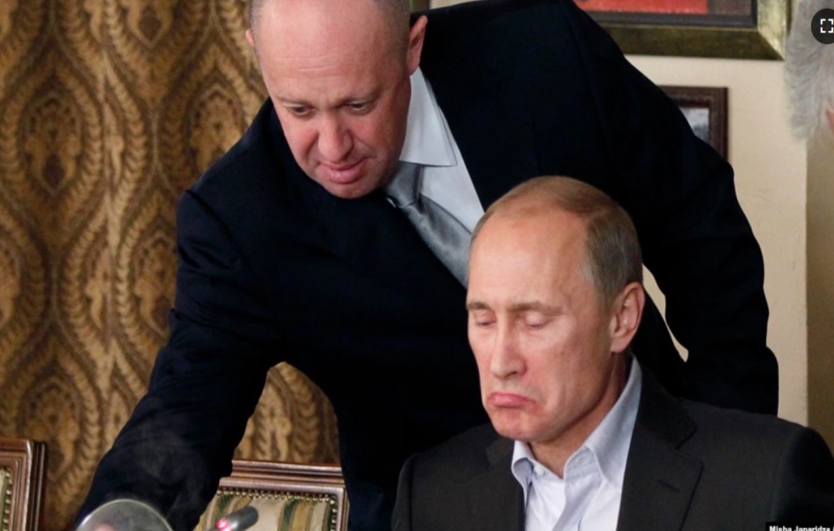 Yevgeny Prigozhin (standing) with Vladimir Putin Photo Misha Japaridze, AP