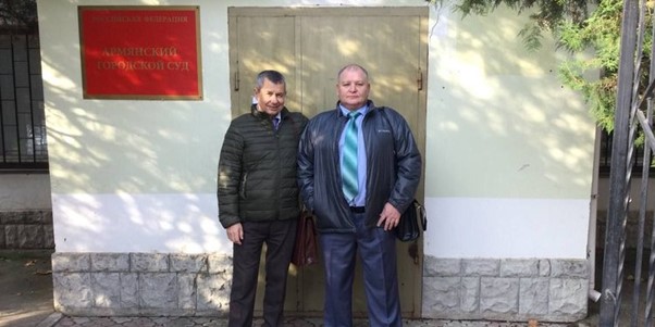 From left Oleksandr Lytvyniuk and Oleksandr Dubovenko outside the ’court’ Photo JW Russian website