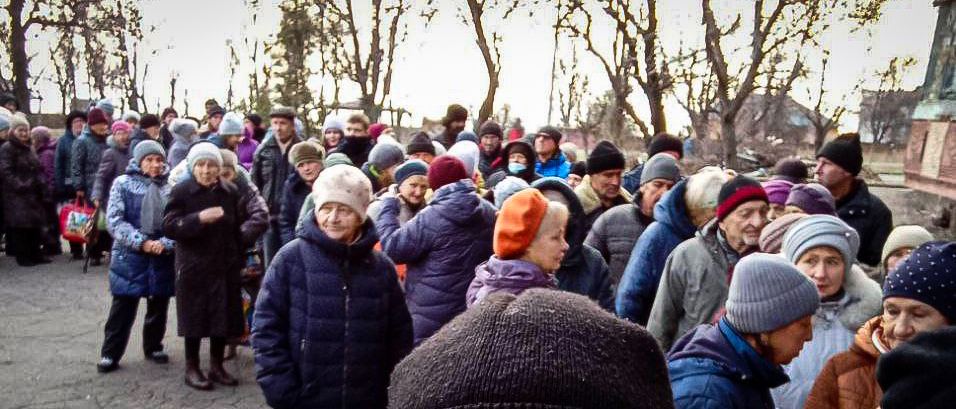 Mariupol People queuing for something warm to eat in freezing December 2022 temperatures Photo posted by Petro Andriushchenko