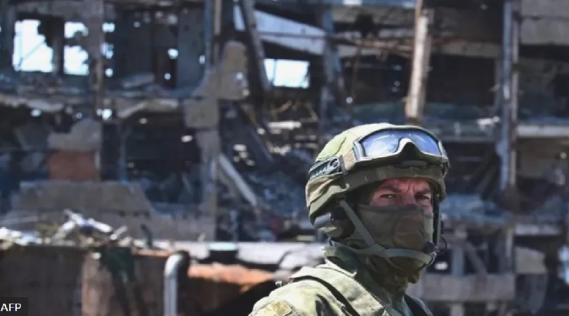 Russian soldier patrolling one of the Ukrainian cities Russia has destroyed in order to seize Photo AFP