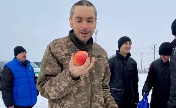 Maksym Kolesnikov, holding his first apple after over 10 months in Russian captivity