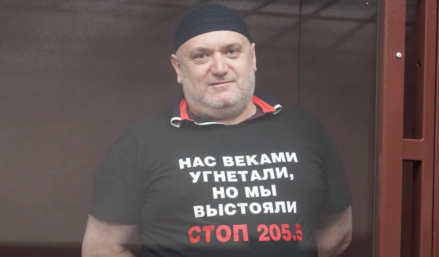 Ansar Osmanov in court in a T-shirt reading ’We’ve been oppressed for centuries, but we withstood. STOP 205.5 (the fabricated charges used in these cases) Photo Crimean Solidarity