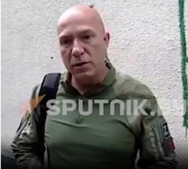 Dzmitry Shoutsou during an earlier interview to the Russian propaganda channel Sputnik. The Russian war symbol ’Z’ is clearly visiible on his camouflage gear