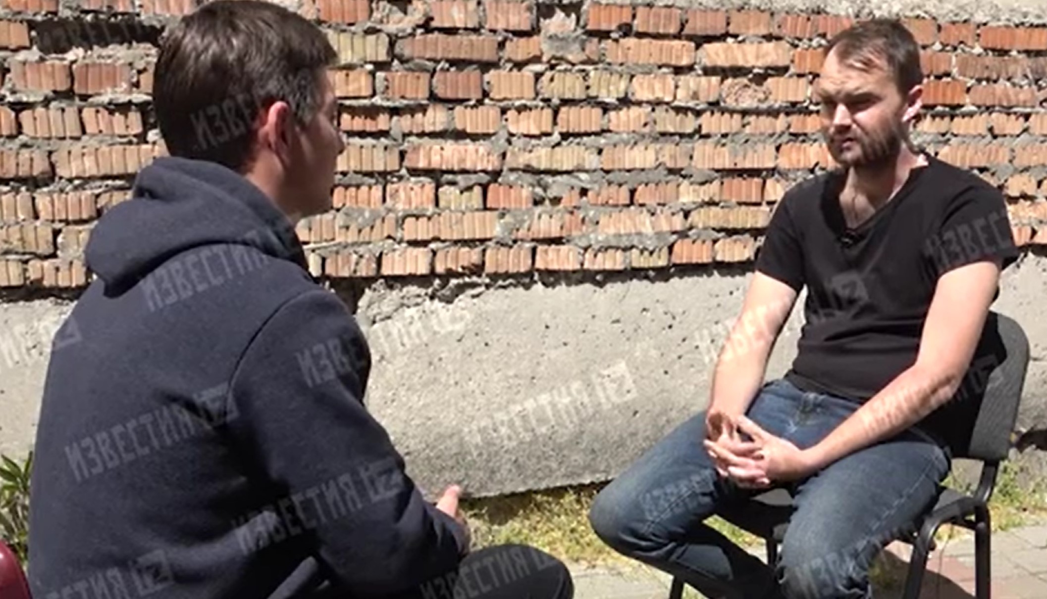 Vladyslav Kryvyy (on the right) during the so-called ’interview’ Screenshot from the video posted by REN-TV