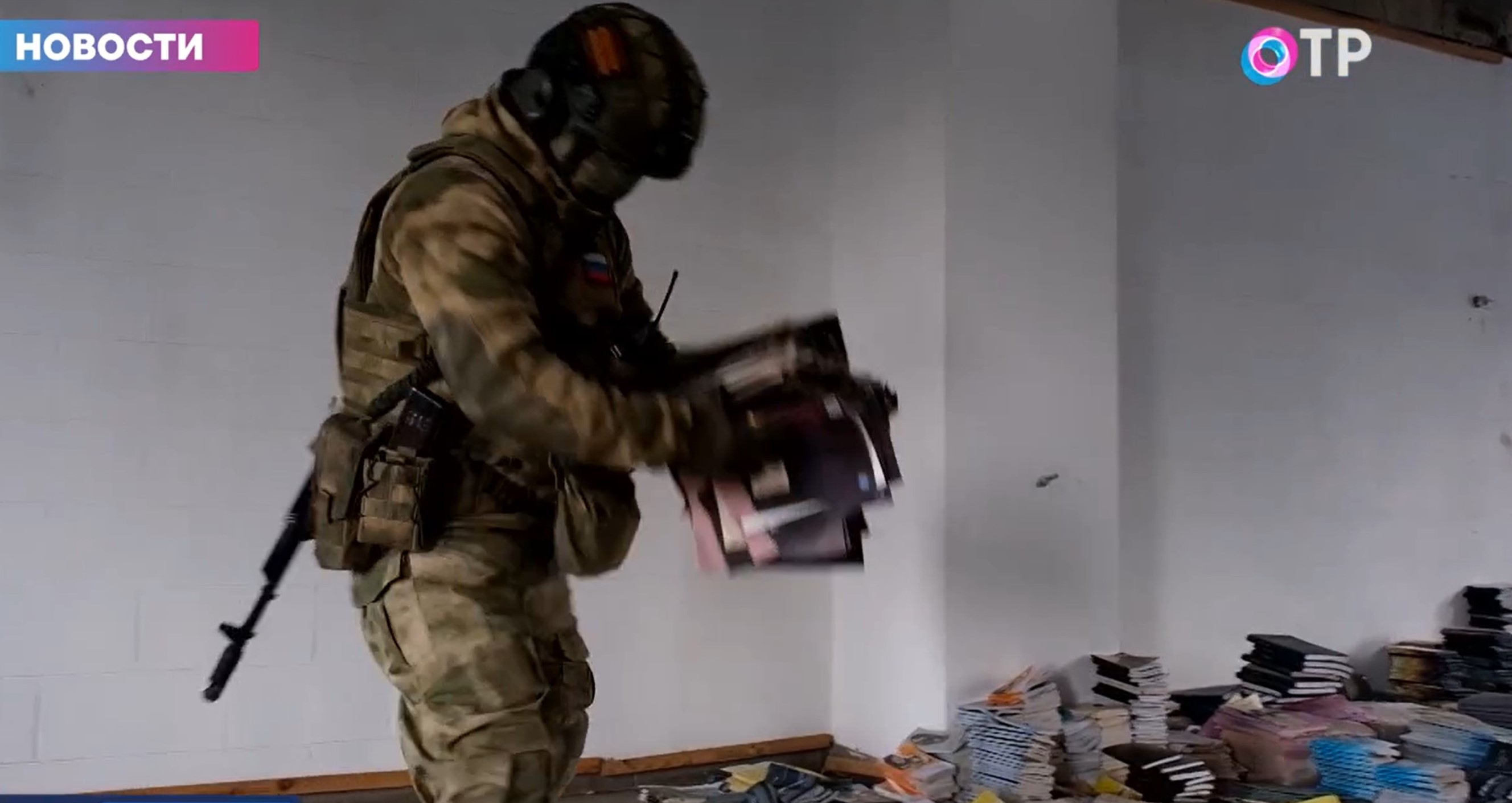 One of the armed and masked Russians who raided a peaceful JW office From the video for propaganda media
