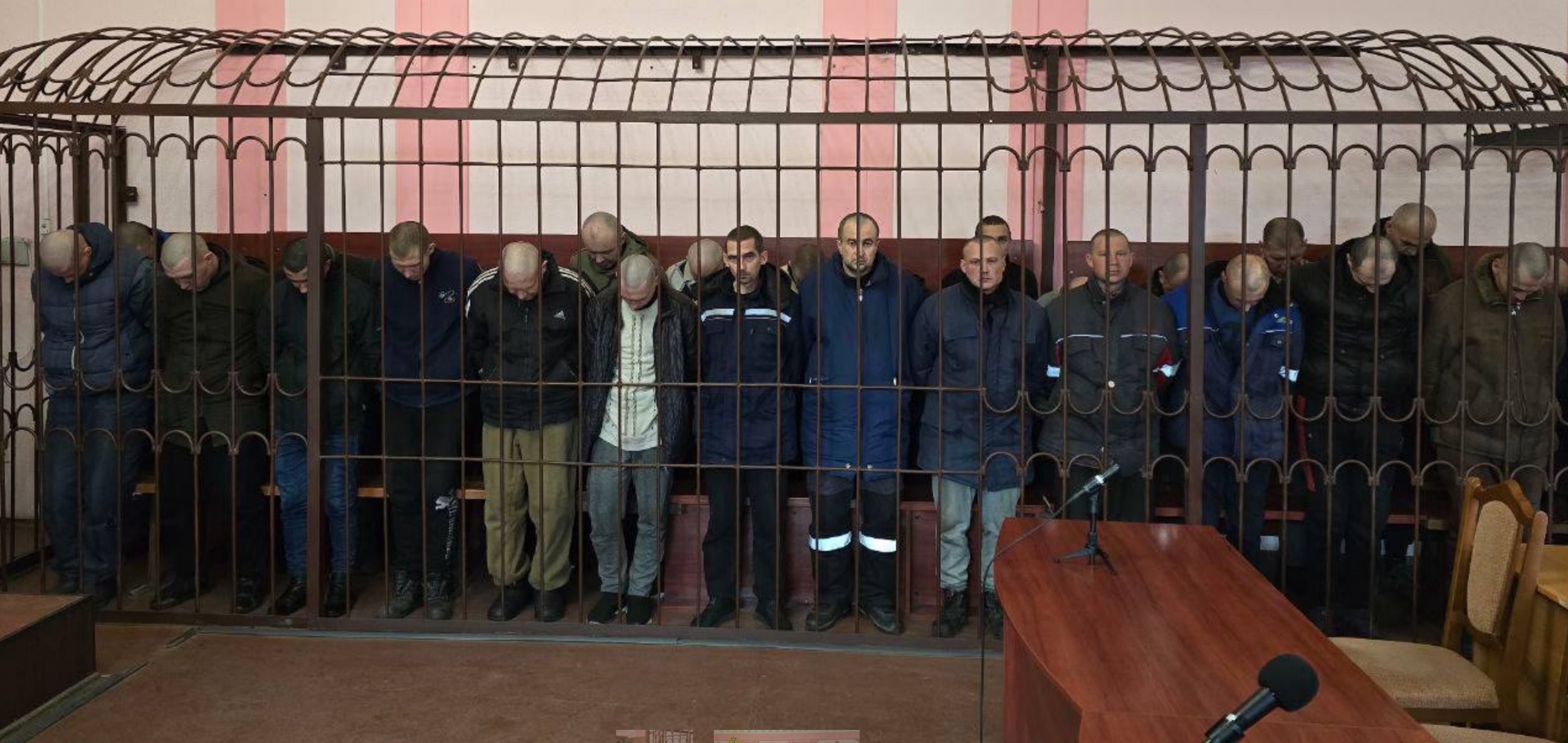 7.02.2024 Ukrainian POWs held in a cage during their illegal and effectively secret ’trial’ in occupied Donetsk Photo posted by Russia’s prosecutor general’s office